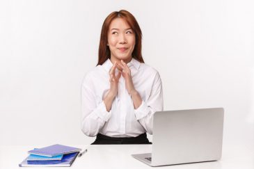 Career, work and women entrepreneurs concept. Close-up portrait of pleased sly asian woman smiling satisfied as dreaming about vacation, lots of money she earn on retail, steeple fingers scheming