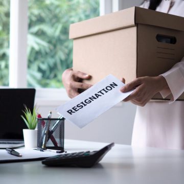 female-businessman-holding-brown-cardboard-box-sends-resignation-letter-management-moving-jobs-vacancies